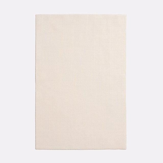 Warm ivory swatch with a fine, subtle woven chevron texture