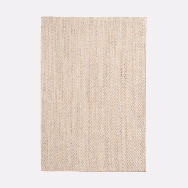 Pale ivory swatch with fine vertical chevron ribs and softly textured woven surface