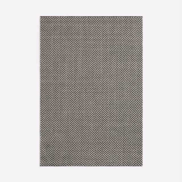 Charcoal-grey woven swatch with repeating small diamond and chevron motifs