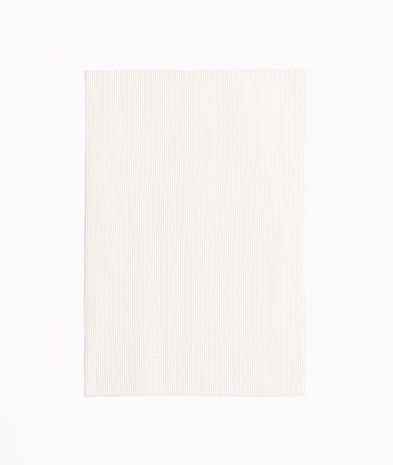 Pale latte fabric with fine vertical ribbing and an ivory-warm surface
