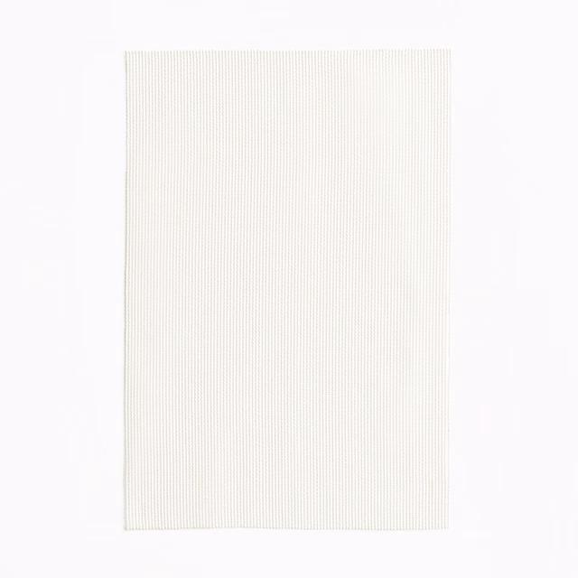 Pale latte fabric with fine vertical ribbing and an ivory-warm surface