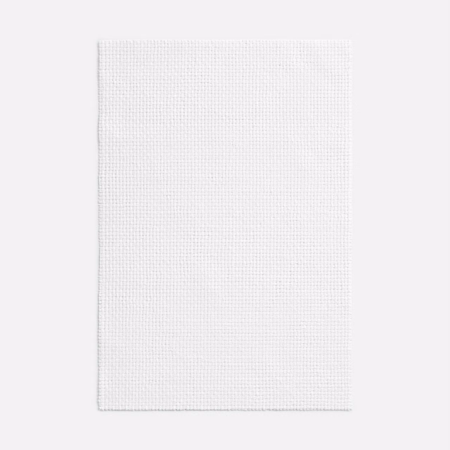 Soft white woven swatch showing a tiny regular grid and lightly textured surface