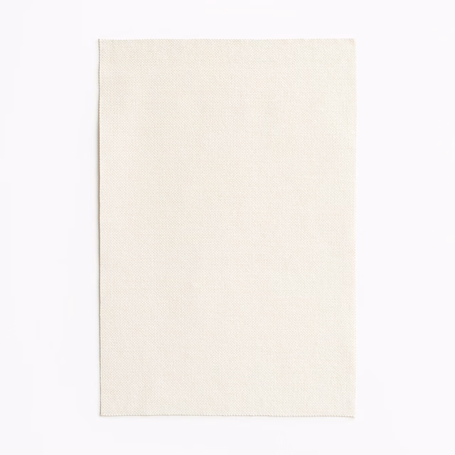Close view of Amaral Avorio’s ivory surface and fine, even woven texture