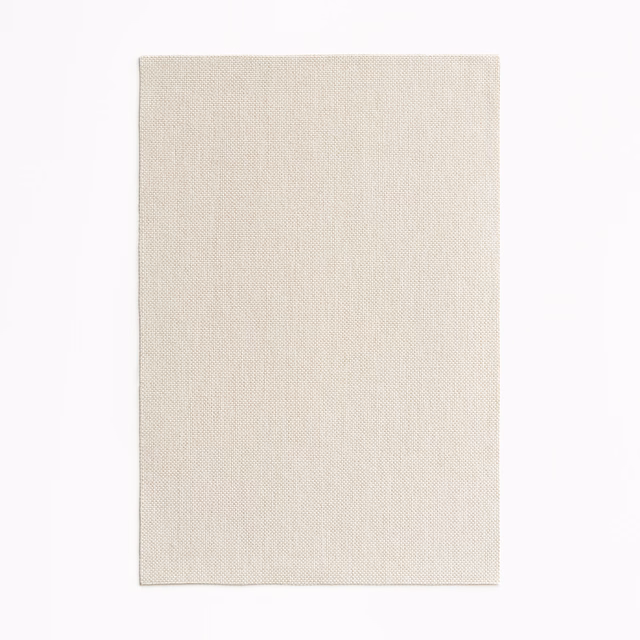 Pale beige Amaral fabric swatch showing a fine, subtly textured woven surface