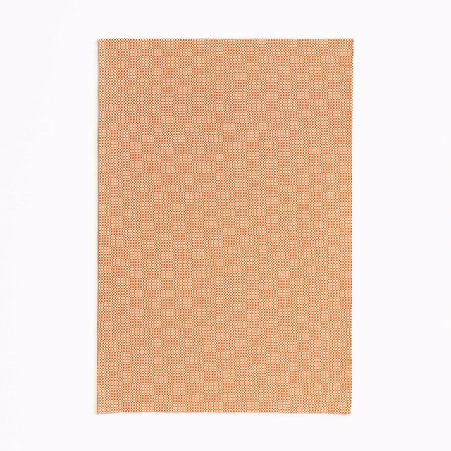 Warm clementine-orange outdoor fabric with a fine, softly mottled woven texture