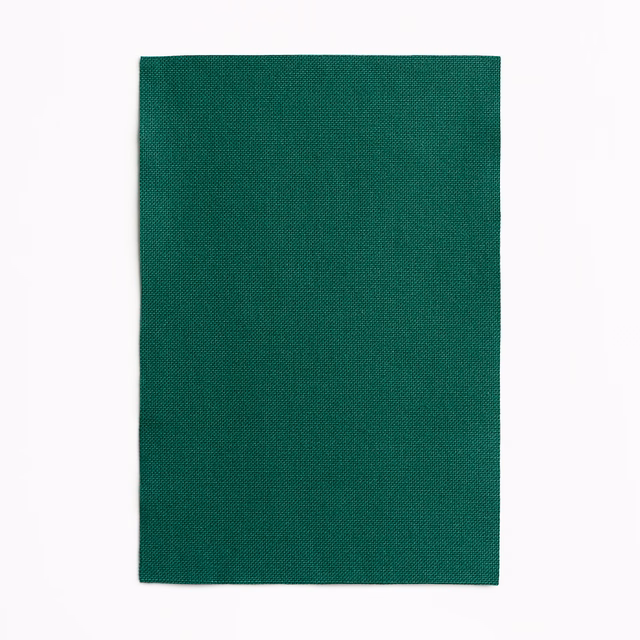 Deep forest-green outdoor textile with a finely grained, tightly woven surface.