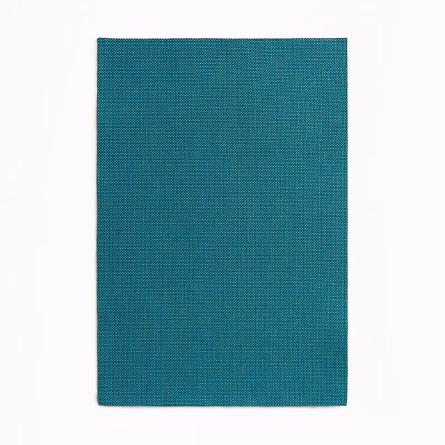 Deep blue-teal outdoor fabric with a fine, tight diagonal woven texture