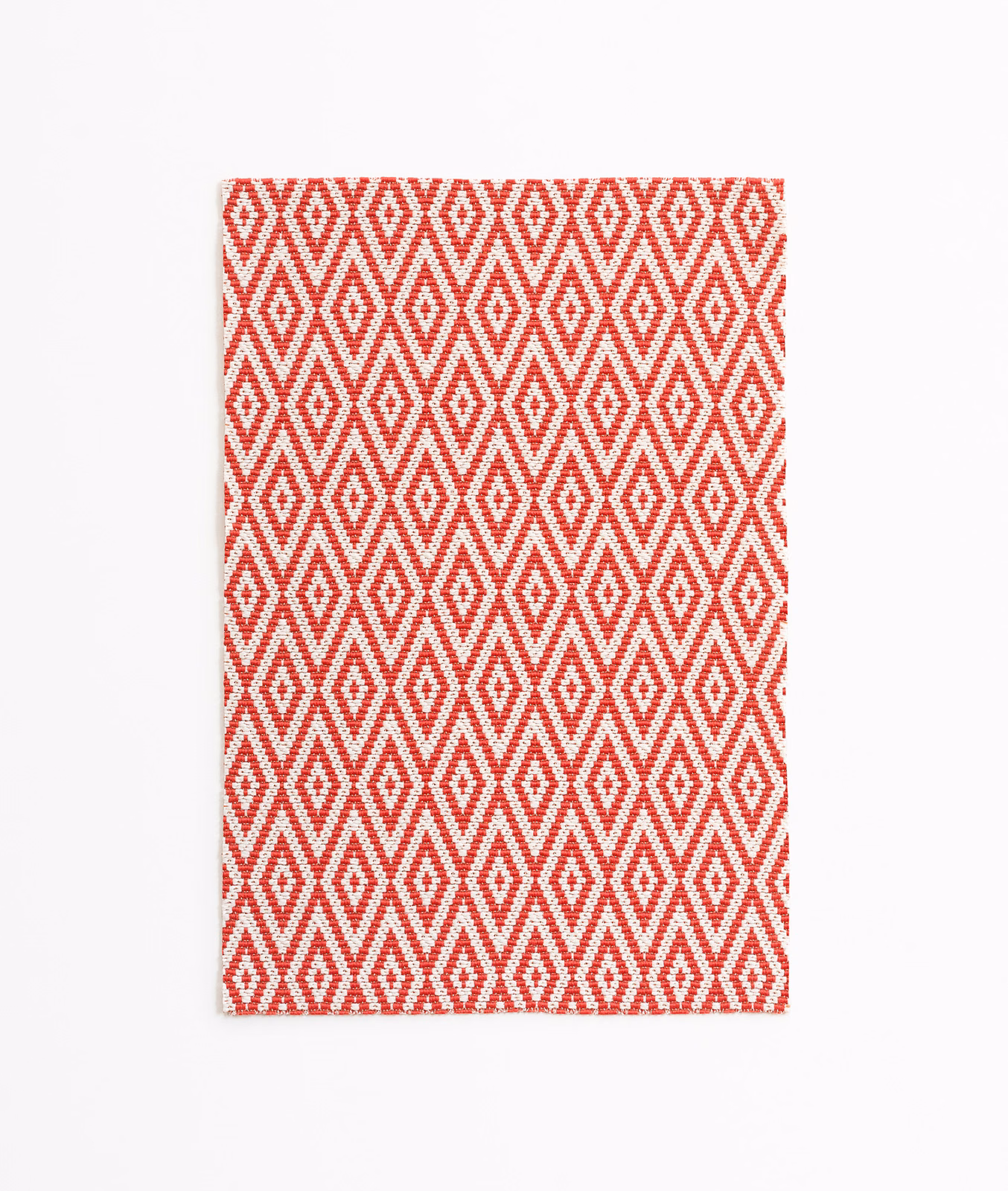Coral-red and white woven geometric diamond pattern on a rectangular fabric swatch