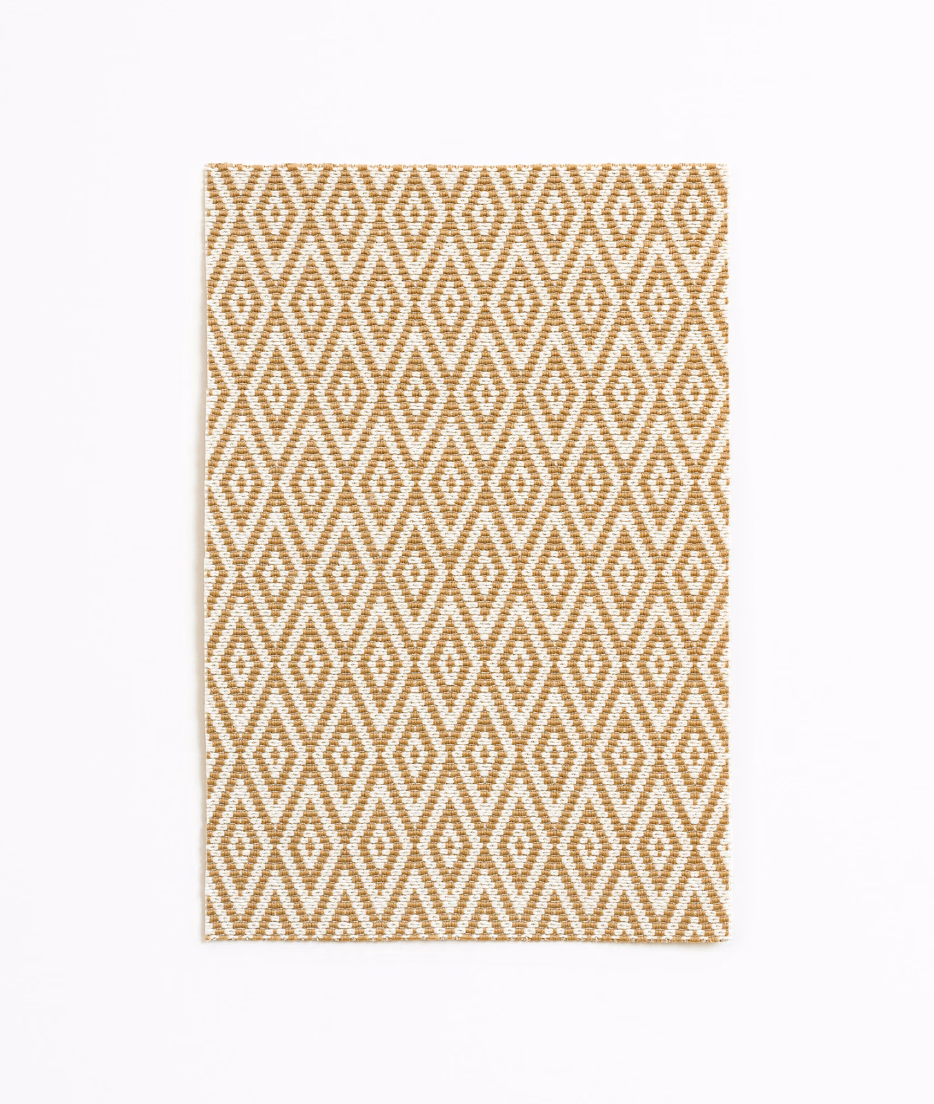 Warm sand fabric with repeating ochre diamond and zigzag geometric weave