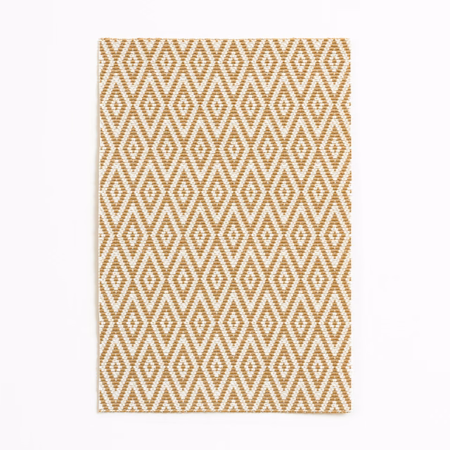 Warm sand fabric with repeating ochre diamond and zigzag geometric weave