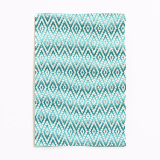 Cool turquoise and white woven diamond pattern with repeating zigzag lines