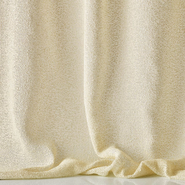 Warm ivory outdoor fabric with a fine irregular weave draped into soft folds