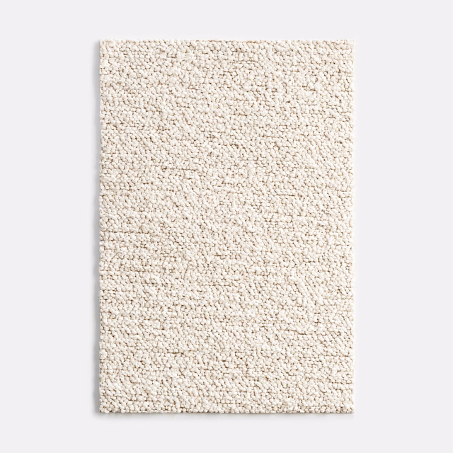 Warm ivory nubby outdoor textile with a dense, softly flecked woven surface