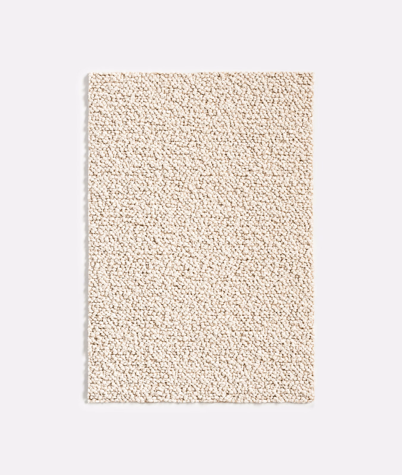 Warm ivory outdoor fabric swatch with dense irregular nubby loop texture
