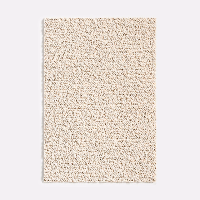 Warm ivory outdoor fabric swatch with dense irregular nubby loop texture
