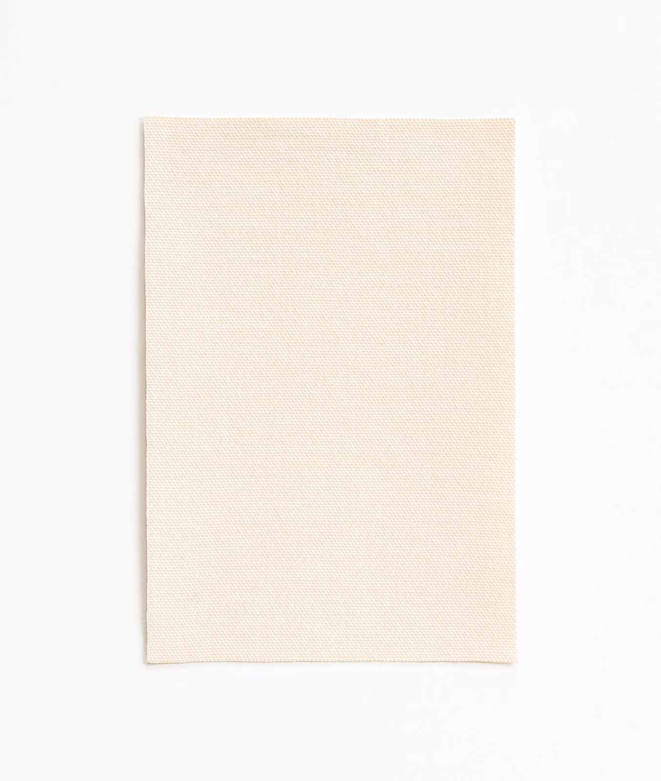 Soft warm ivory outdoor fabric with a fine, even woven surface