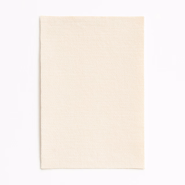 Soft warm ivory outdoor fabric with a fine, even woven surface