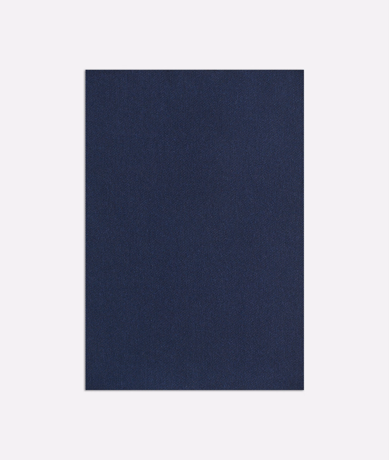 Deep denim-blue woven fabric with a subtle fine-grained surface