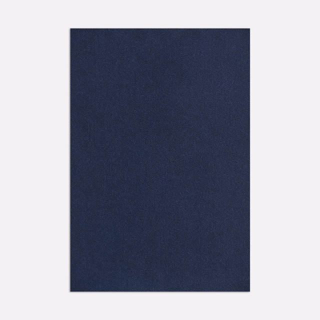 Deep denim-blue woven fabric with a subtle fine-grained surface