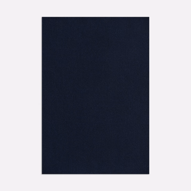 Deep ink navy outdoor fabric swatch with a fine, subtly textured woven surface