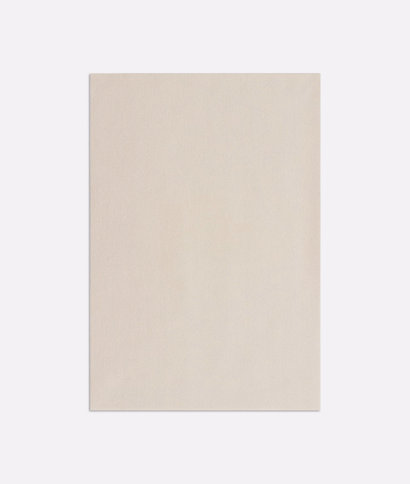 Close-up of softly warm beige outdoor fabric with a fine, subtle woven texture
