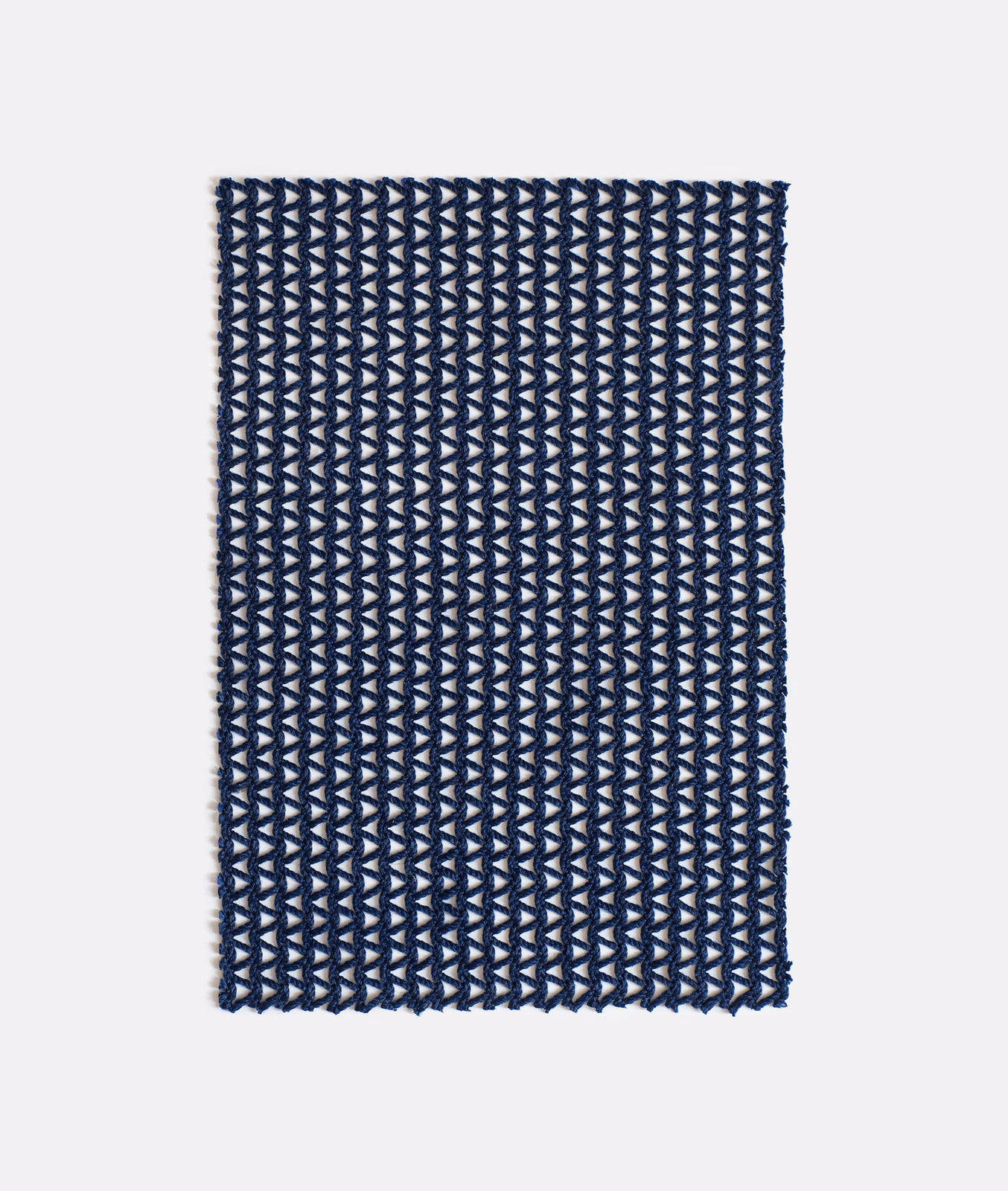 Deep navy woven swatch with repeating pale blue-grey arrowhead motifs