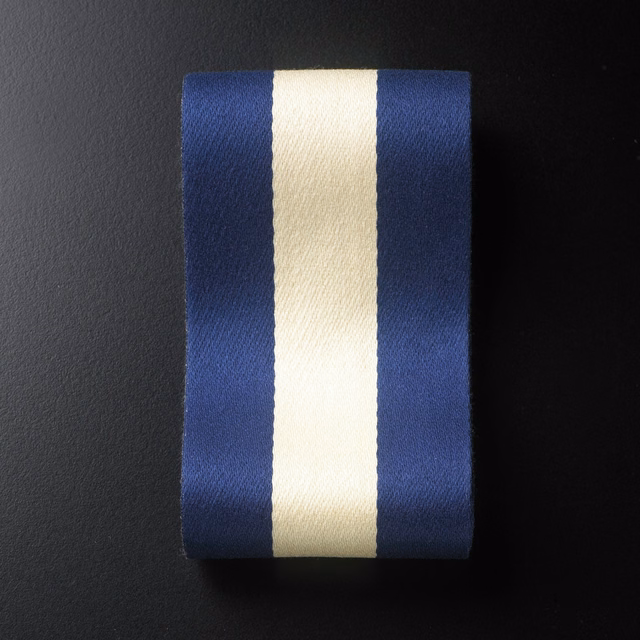 Deep navy fabric with broad ivory vertical stripe and subtle woven grain
