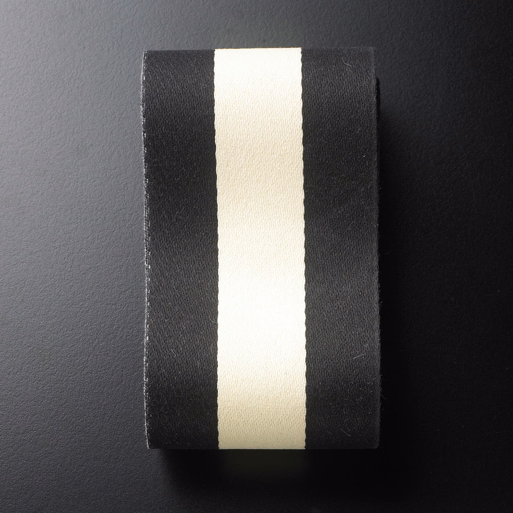 Black and ivory vertical ribbon stripes on a subtly textured woven swatch