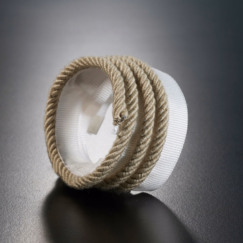 Warm oatmeal twisted lipcord wrapped around an ivory ribbed textile core