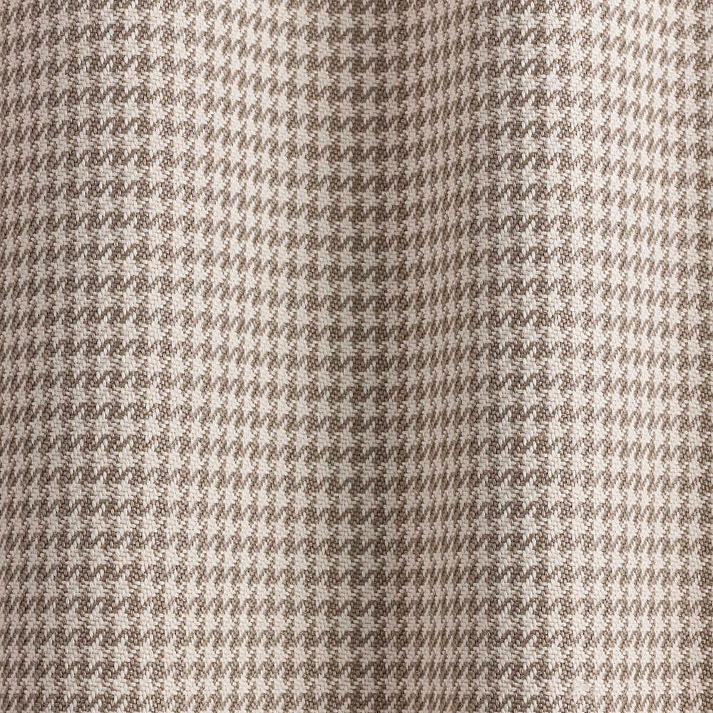 Close-up of beige and taupe woven micro-houndstooth fabric with softly textured surface
