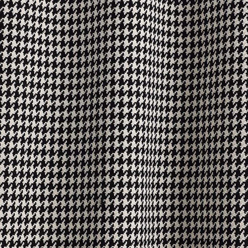 Close-up of black and white houndstooth weave with softly varied tonal texture