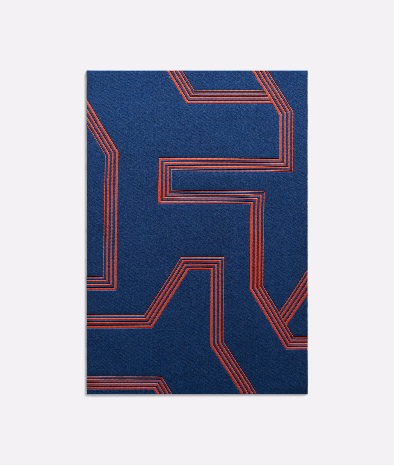 Deep navy jacquard with angular coral-red multistripe geometric lines