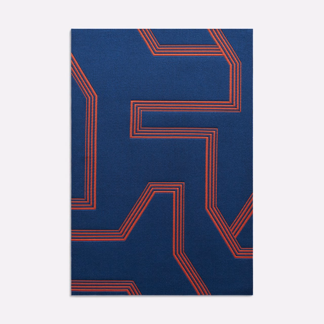 Deep navy jacquard with angular coral-red multistripe geometric lines