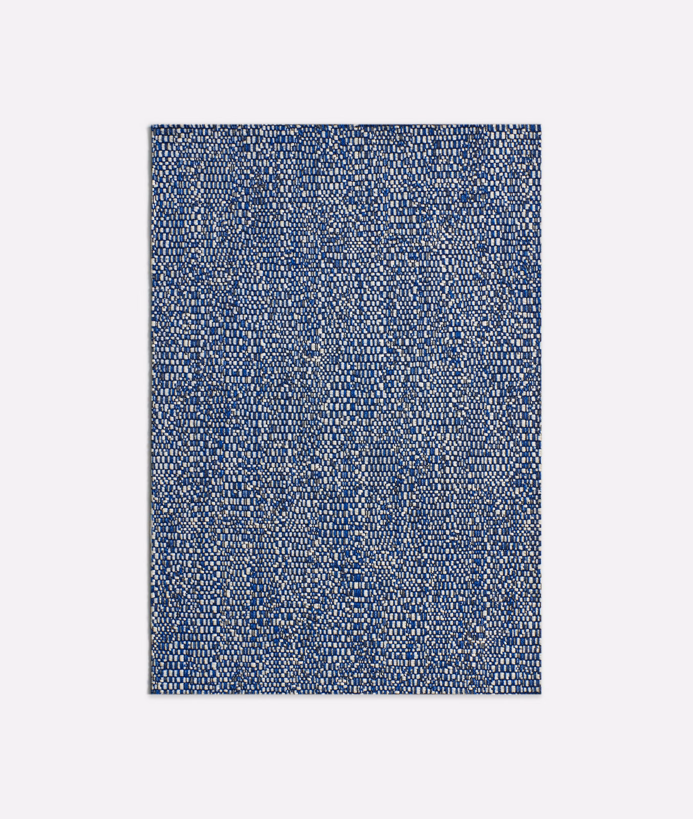 Dense deep-blue jacquard with tiny cream flecks and softly mottled woven texture