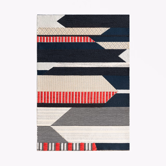 Angular jacquard bands in cream, navy, charcoal and red with fine woven texture