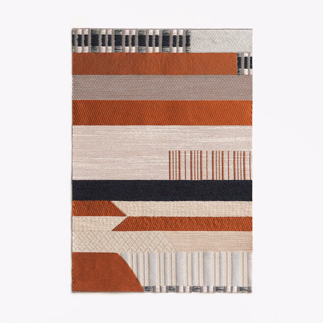 Rust, cream and charcoal jacquard with horizontal bands and geometric woven motifs