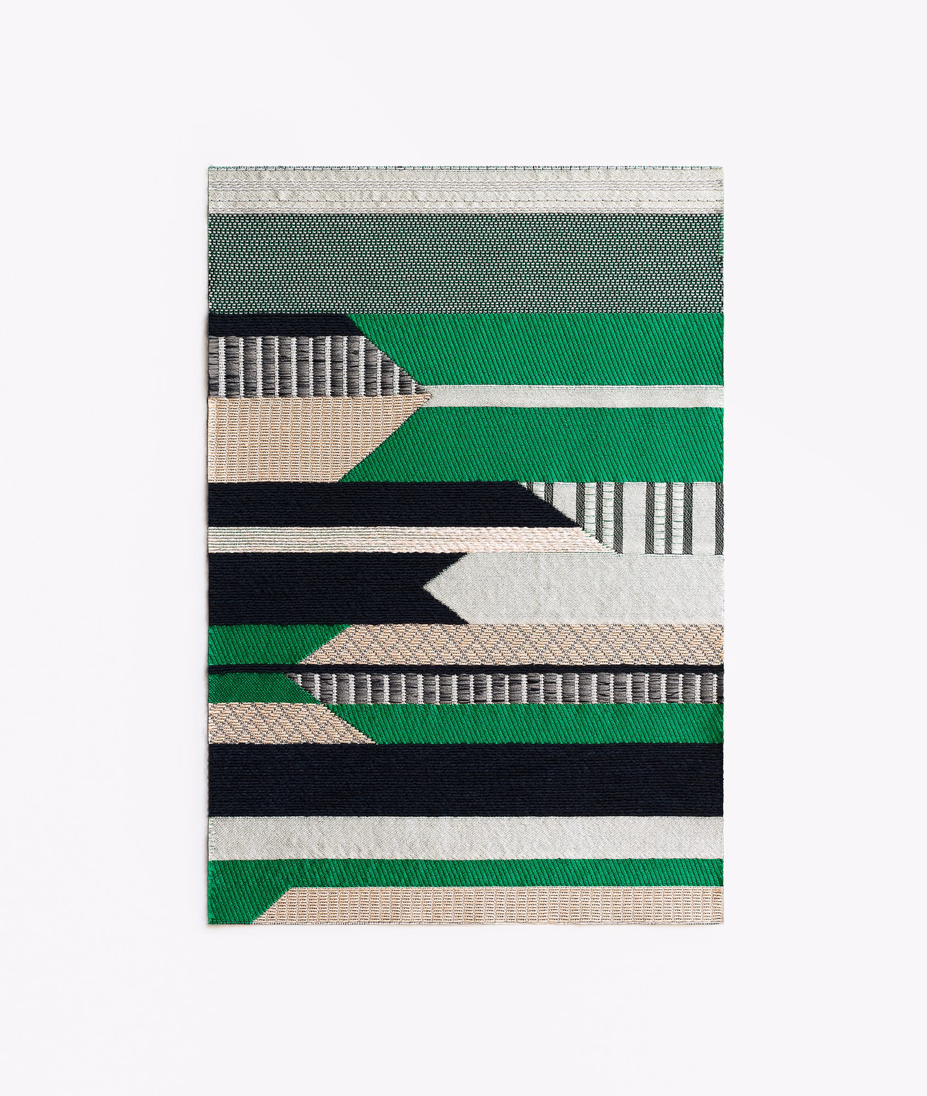 Emerald green jacquard swatch with black, ivory and taupe geometric bands