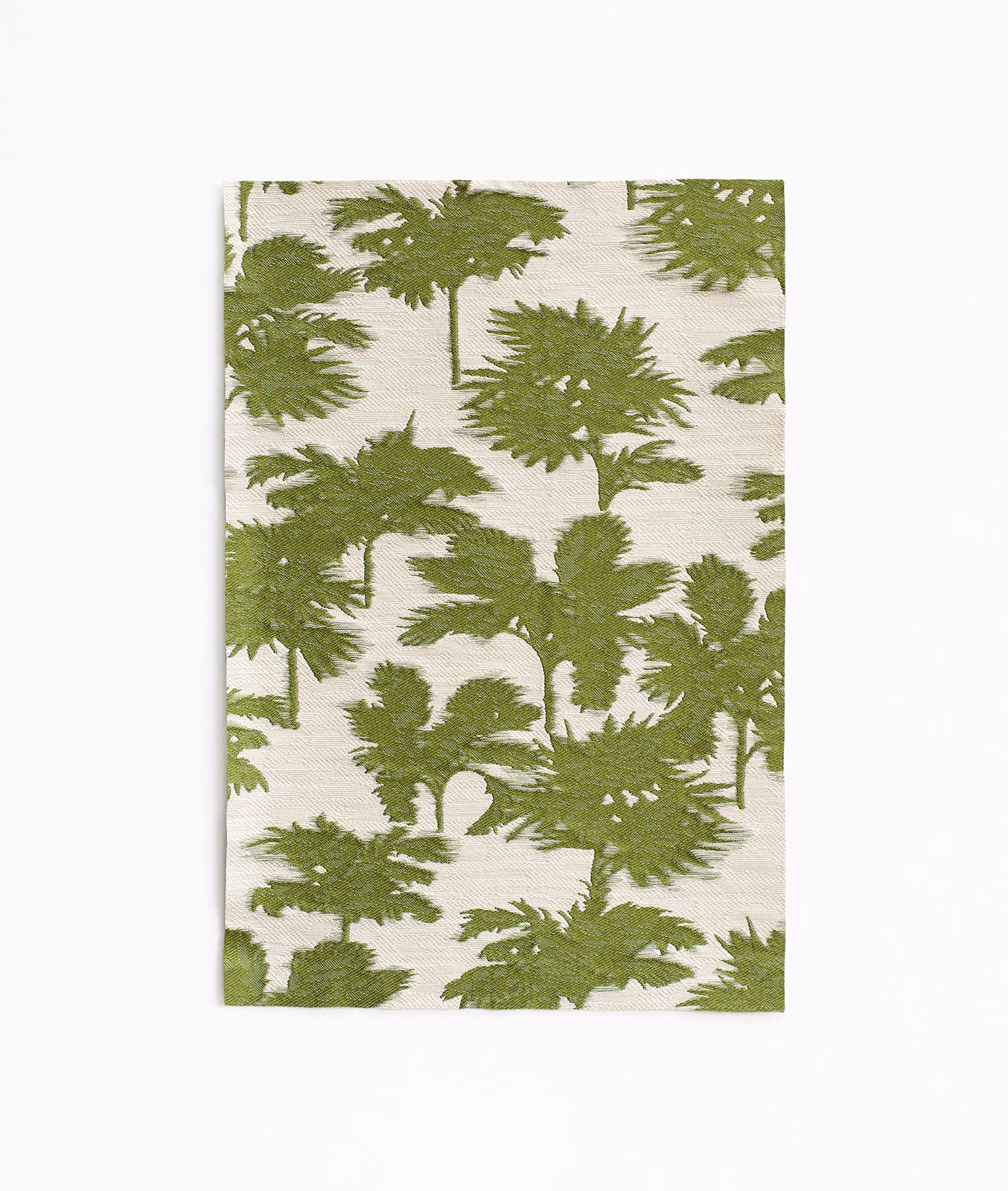 Muted cactus-green fern silhouettes over an ivory jacquard weave