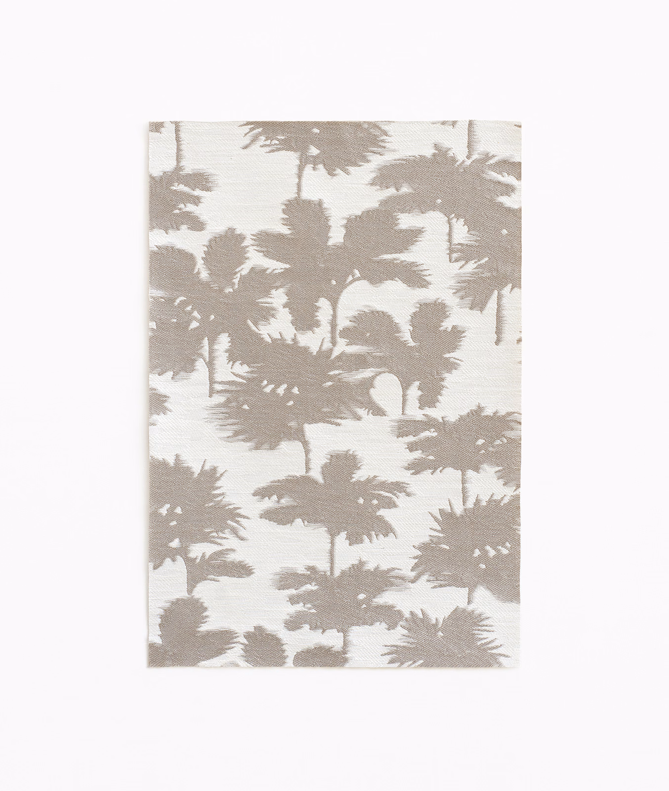 Warm taupe palm silhouettes across an ivory textured jacquard ground