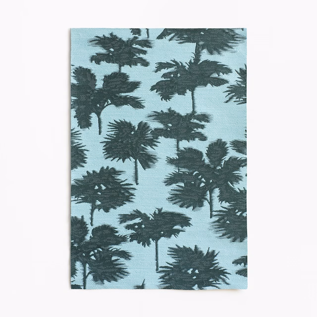 Pale aqua jacquard with dense dark teal palm silhouettes and visible woven texture