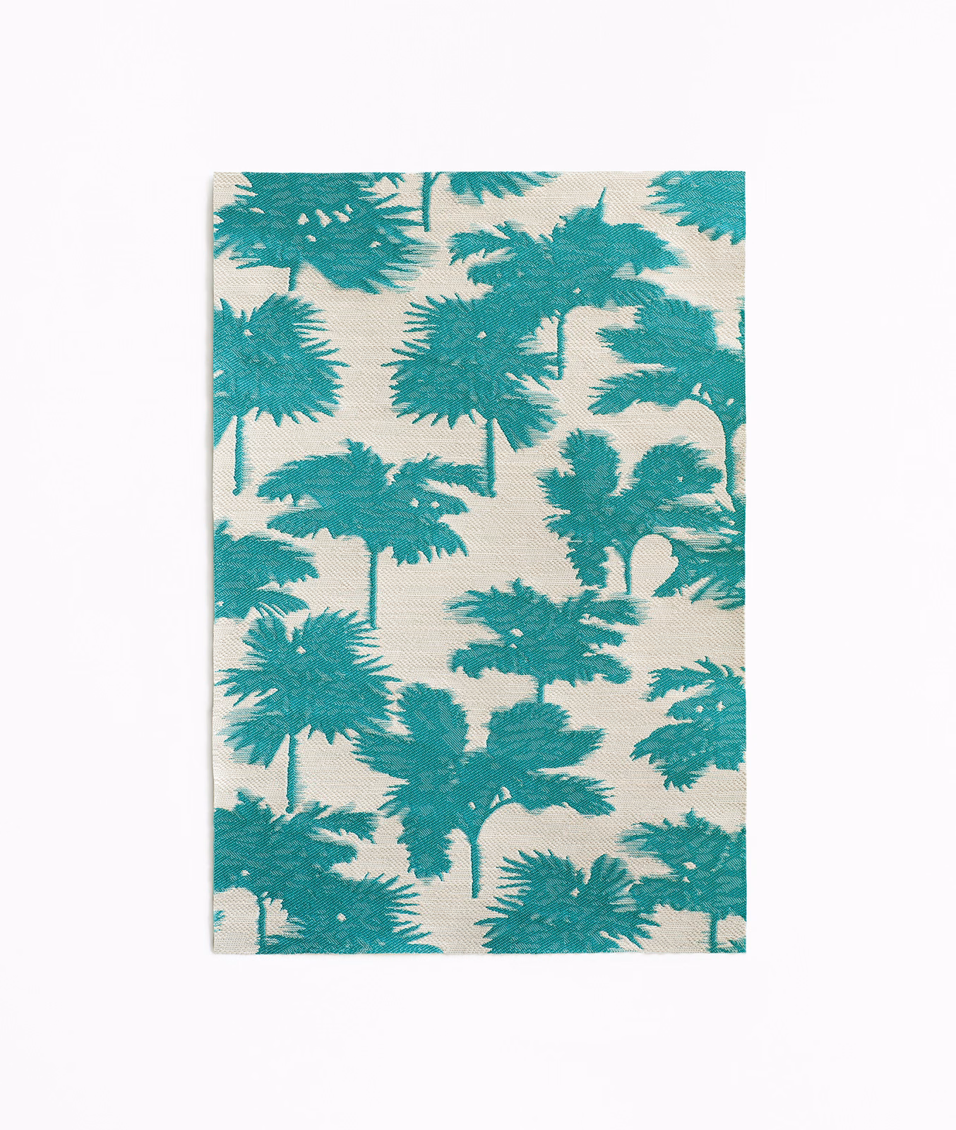 Turquoise palm silhouettes scattered across an ivory jacquard fabric swatch