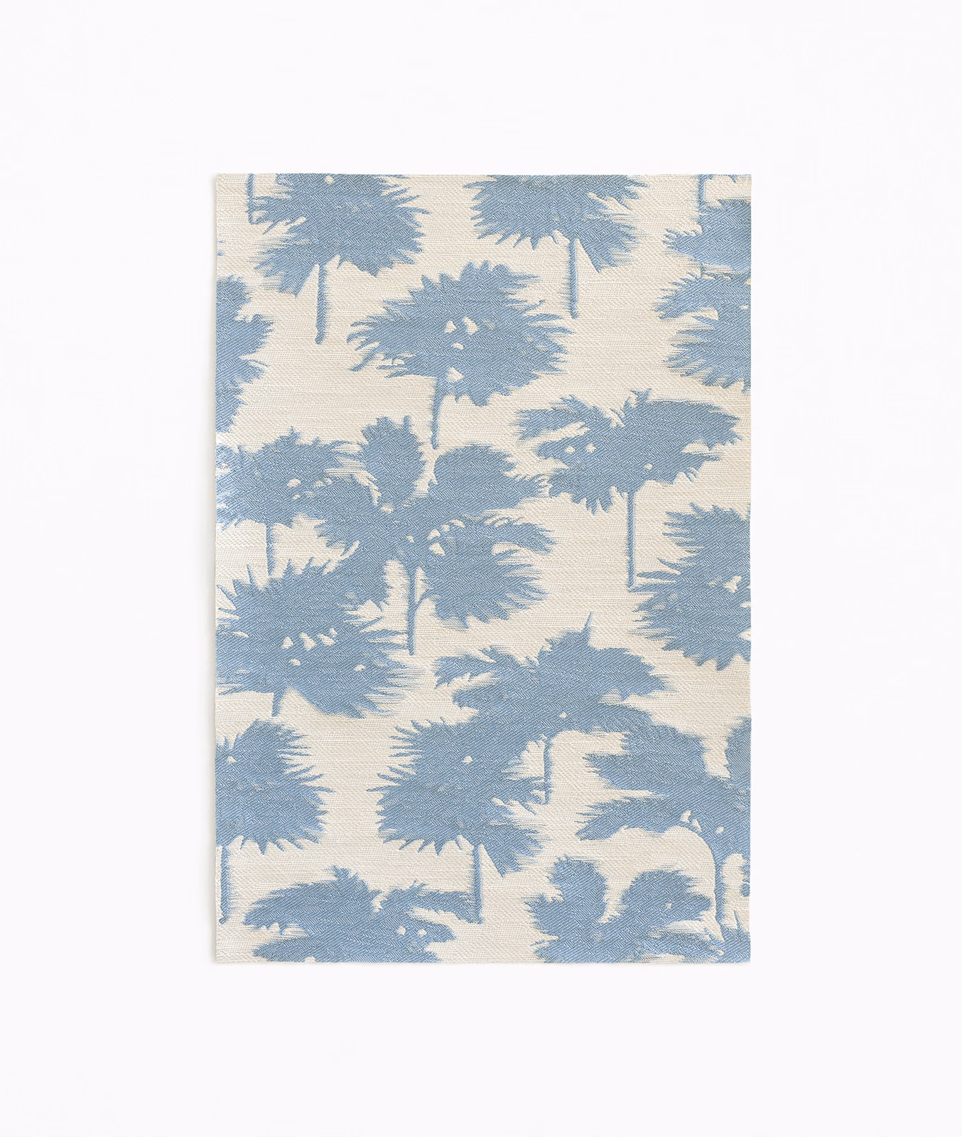 Powder-blue palm silhouettes scattered across a softly textured ivory jacquard
