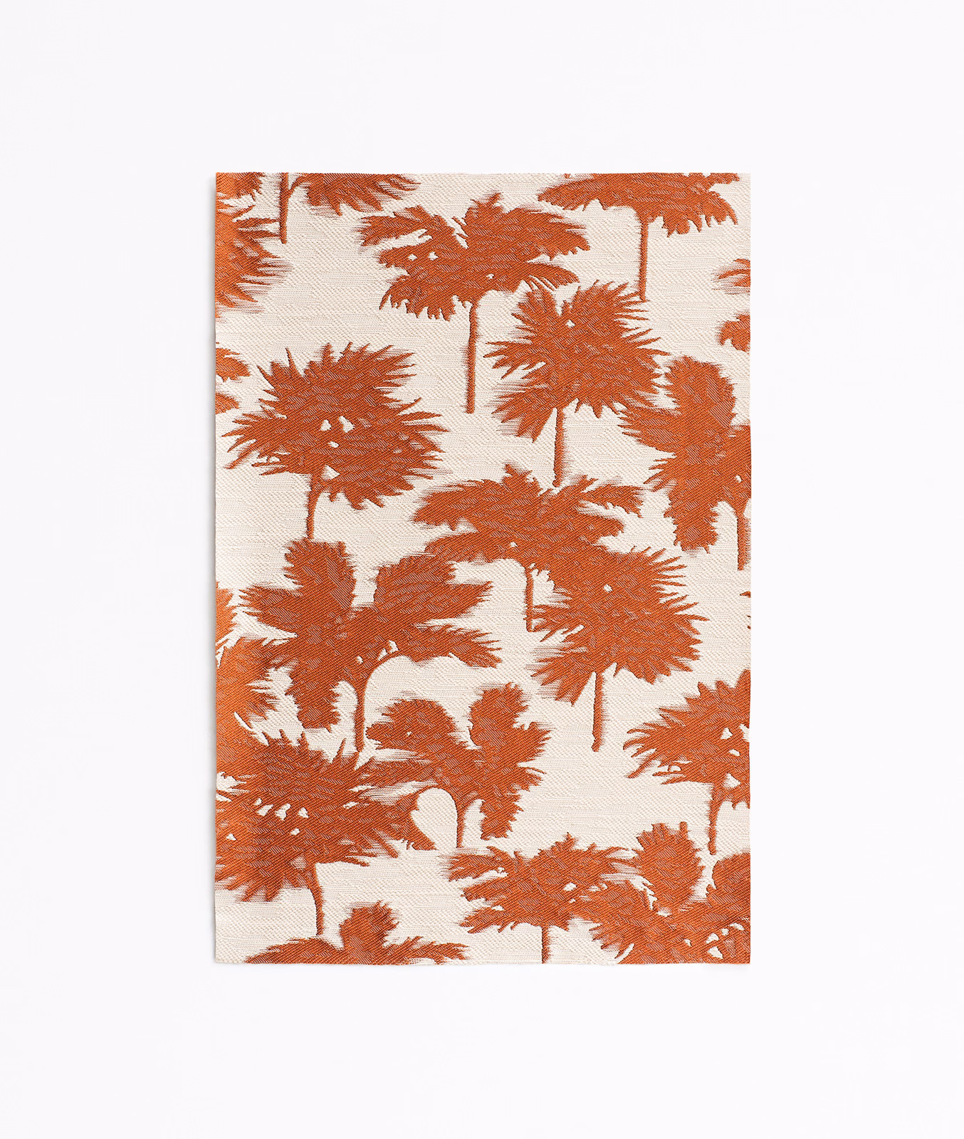 Terracotta palm silhouettes scattered across a warm ivory jacquard ground