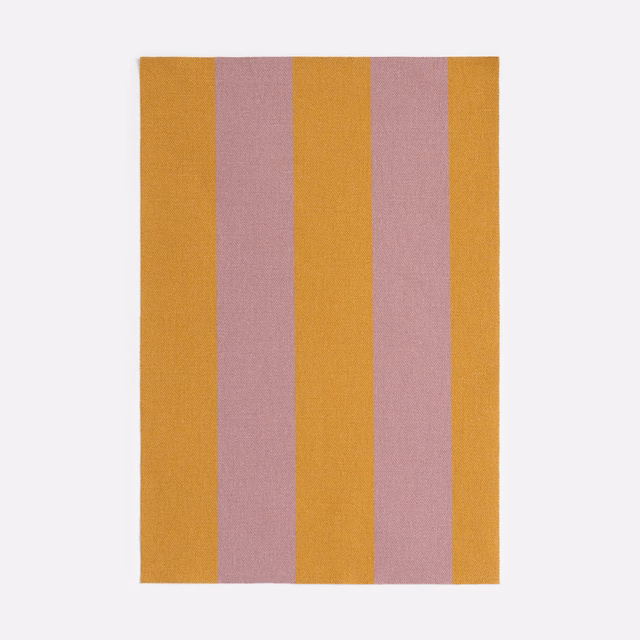 Broad ochre and dusty mauve vertical stripes in a softly textured weave