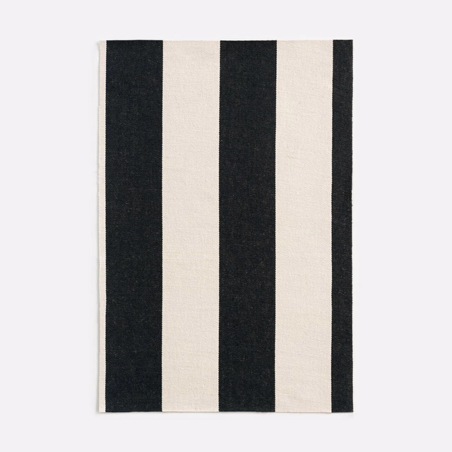 Black and ivory vertical stripe jacquard with a finely textured woven surface