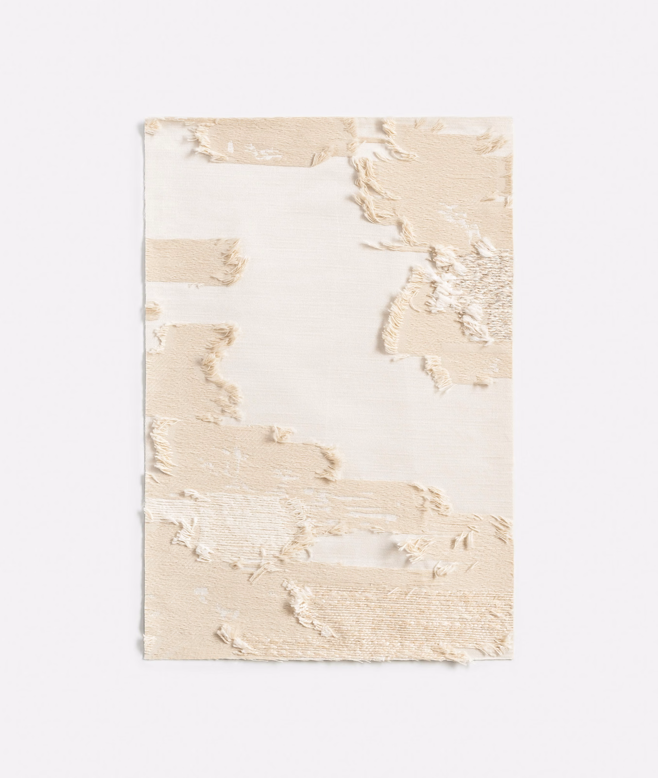 Cream and pale beige jacquard with torn painterly relief and softly raised threads