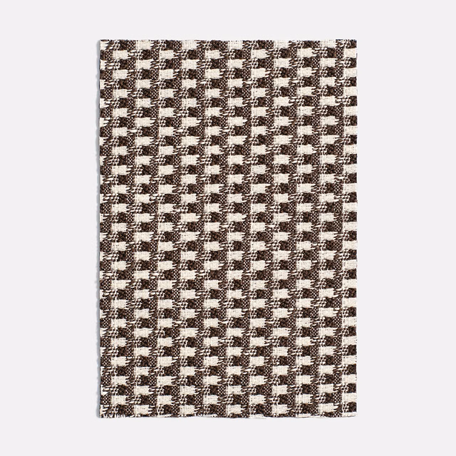 Chocolate brown and ivory small-scale geometric jacquard with a flecked woven texture