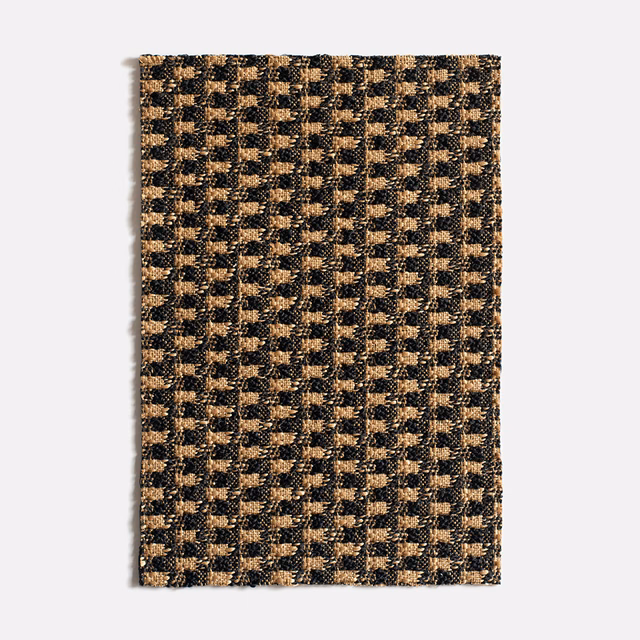 Charcoal and ochre Canasta Mordoré jacquard with a small tactile geometric weave