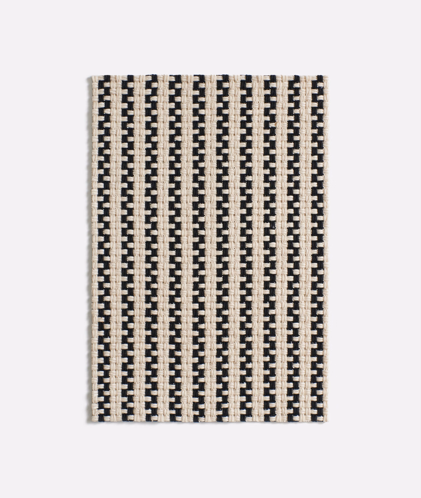 Ivory and black jacquard with narrow vertical brick-like stripes and crisp woven texture