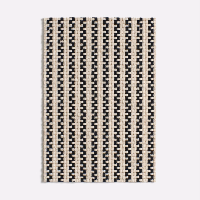 Ivory and black jacquard with narrow vertical brick-like stripes and crisp woven texture